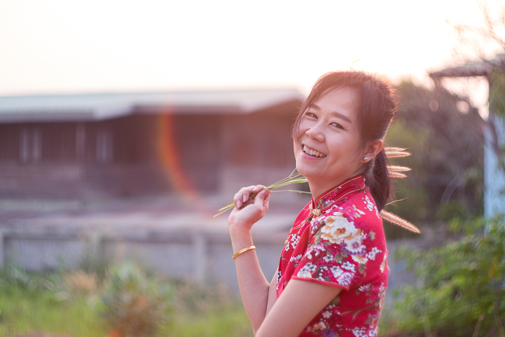 Charming,Beautiful,Chinese,Woman,Standing,And,Smiling,With,Haapy.